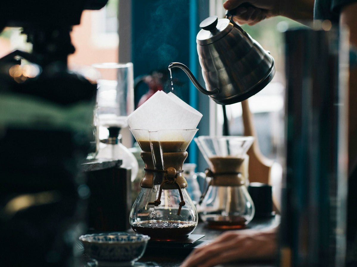 Coffee being brewed on a cafe bar