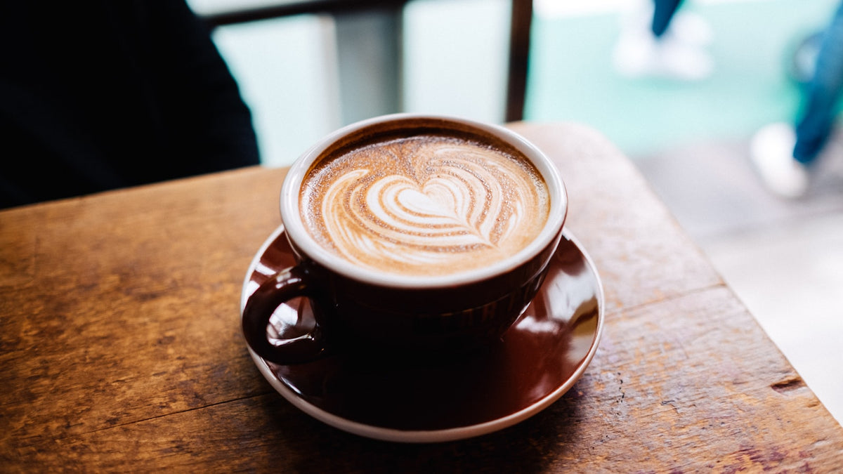 Close up of latte art in a brown cup