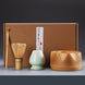 Matcha tea ceremony set with teapot, bowl and bamboo whisk